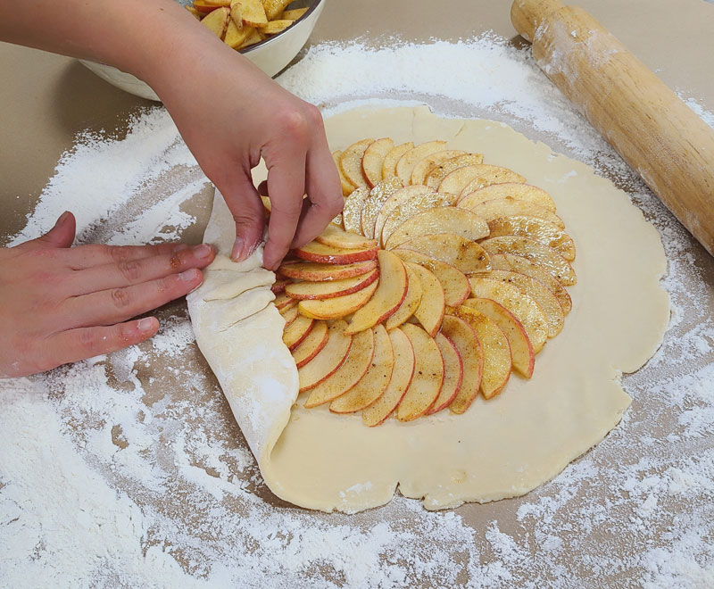 Chef making an Apple Galette with Candied Cranberry Topping - crust technique